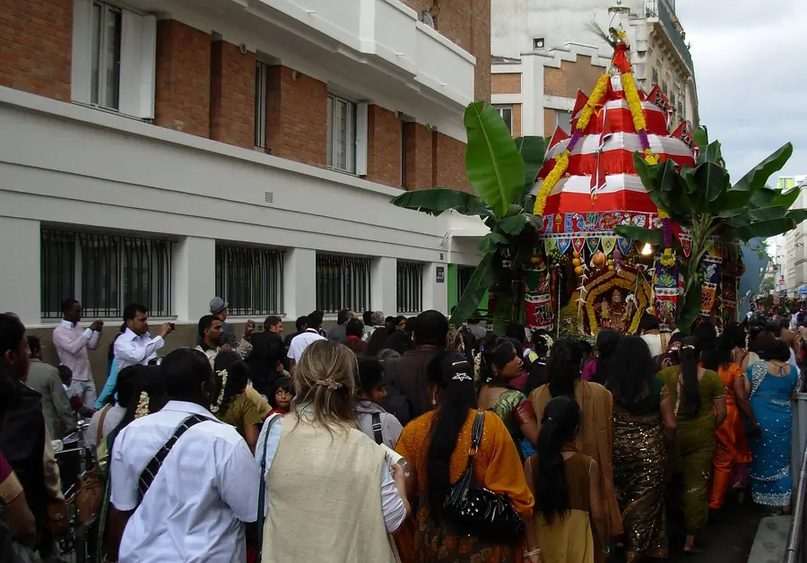 A decorated Ganesh chariot with banana leaves in the Ganesh Chaturthi procession through Little Jaffna, Paris